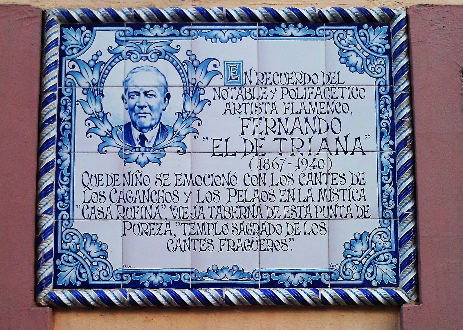 A blue and white tile plaque with a portrait and a dedication to the flamenco artist Fernando el de Triana, 1867 to 1940